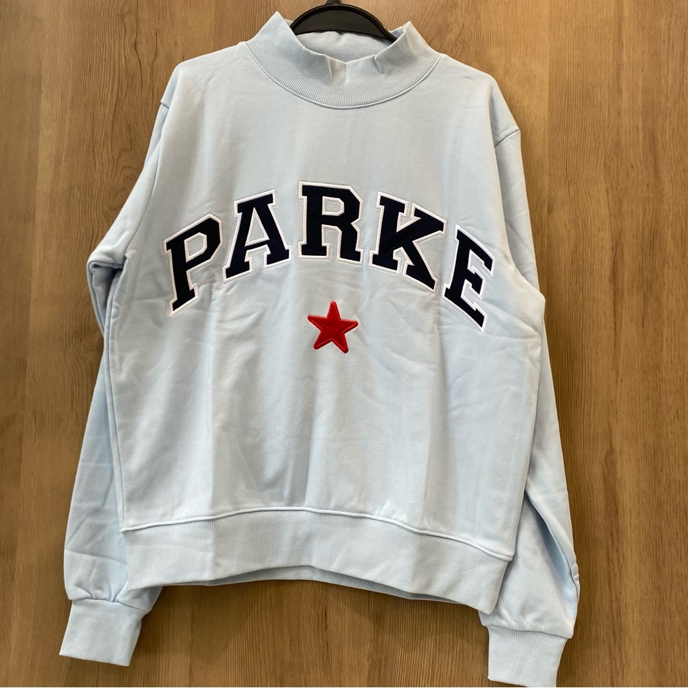 Parke Light Blue Mock Neck Sweatshirt with Red Star Accent